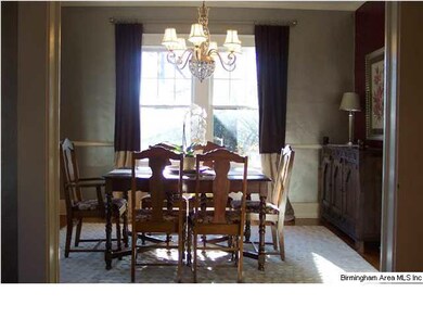 Lovely dining room with lots of wall space.