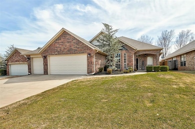 View of front of property featuring driveway, roof
