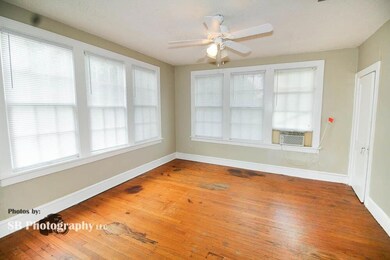 Unfurnished room featuring ceiling fan and hardwoo