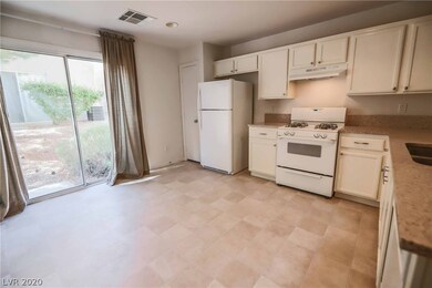 Kitchen with white appliances, refrigerator includ