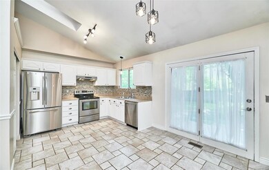 French door to the patio and privacy fenced back y