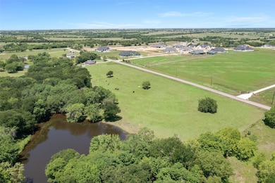 View of property location featuring rural landscape and a large body of water