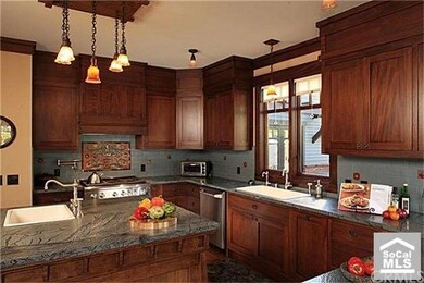 Another view of kitchen with large island workspac