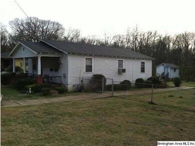 Side of house and vacant lot.