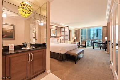 Bedroom featuring light colored carpet, crown mold