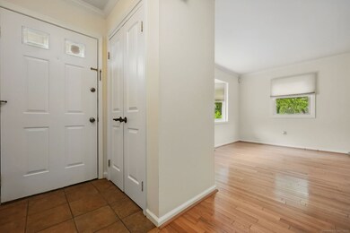 Foyer with coat closet.
