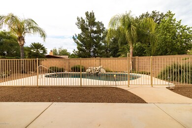 Private covered patio overlooking pool!