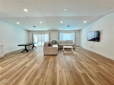 Living area with light wood finished floors, plent