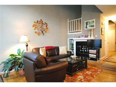 Living Room with Hardwood Floors, Fireplace, Vault