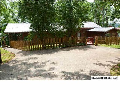 This awesome river home offers incredible views of the Elk River and includes a huge amount of exterior living spaces and a boathouse with 2 slips.
