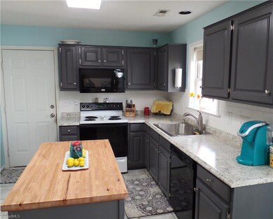 Beautiful countertops and butcher block island make meal time a breeze!