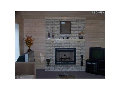 FAMILY ROOM FIREPLACE WITH RAISED HEARTH AND MANTL