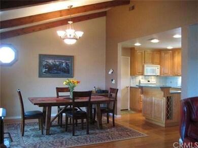 Vaulted ceilings enhance the dining area that open
