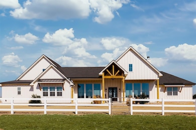 View of front of house featuring board and batten