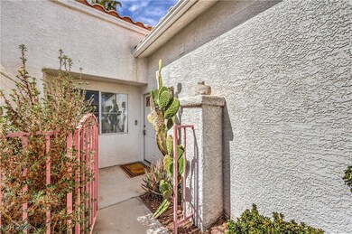Entrance to property with stucco siding