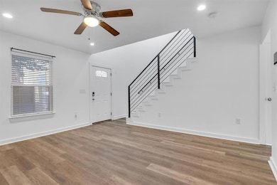Entrance foyer with recessed lighting, stairway, 