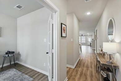 view of office to left. Mid hallway to left is hal