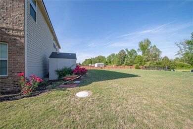 View of yard featuring a storage unit