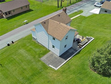 Aerial View of back of structure and patio.