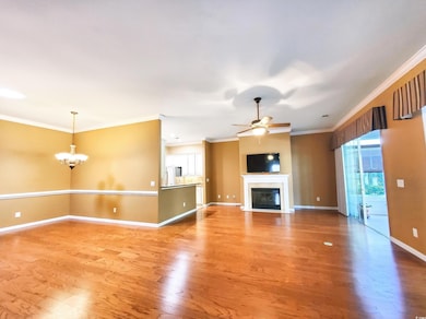 Dining room with chandelier, engineered wood floor