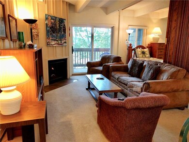 Bright and airy living area with walk out deck.