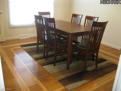 Gorgeous wood floors in formal dining room