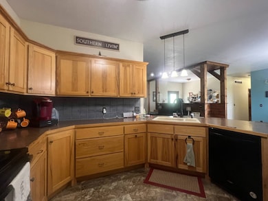 kitchen open to dining and living area