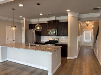 Kitchen featuring appliances with stainless steel 
