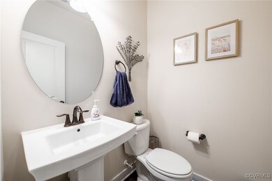 Half bath with a sink and toilet