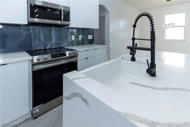 1409 Santa Barbara Blvd N, Cape Coral, FL 33993 - photo 7