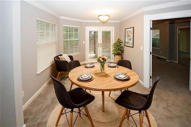 Dining room with french doors, ornamental molding,
