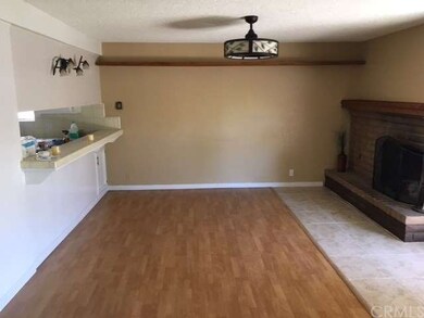 Family room with bar and fireplace.