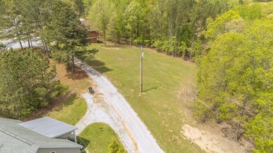 Drone / aerial view featuring a wooded view