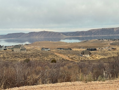 View of mountain backdrop featuring a large body of water