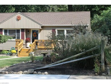 Superb landscaping and lawn, newer front porch/dec