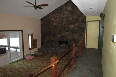 Livingroom toward fireplace and hallway