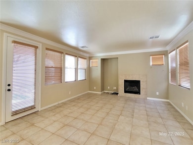 Unfurnished living room featuring a tile fireplace