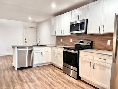 Kitchen featuring appliances with stainless steel 