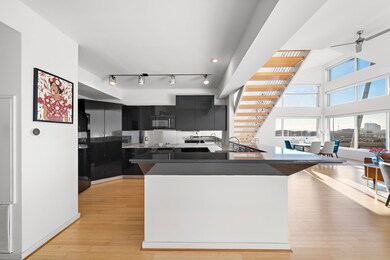 The contemporary kitchen boasts a modern backsplas