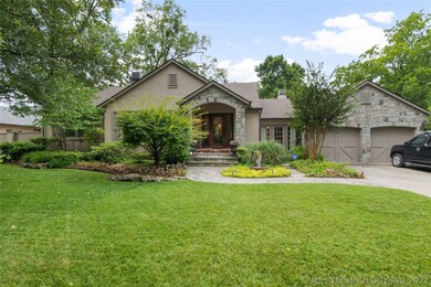 Large front yard with mature trees and heavy lands