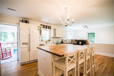 The kitchen features granite counter tops and ador