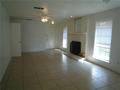 Unfurnished living room with light tile patterned 