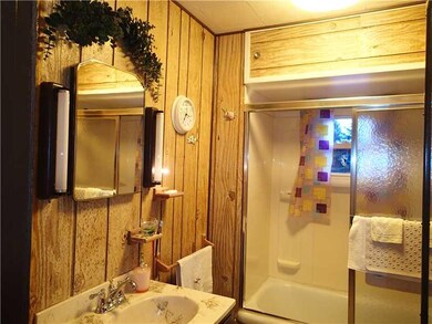 Full Bath. Full bath in the rear raised ranch has 
