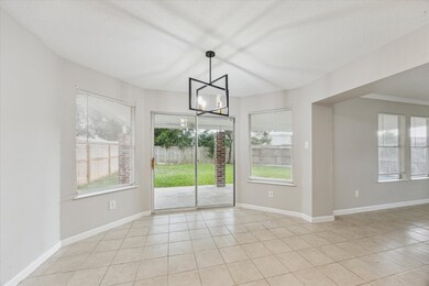 Bright and inviting breakfast area with abundant n