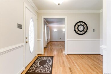 Foyer view into living room, office or playroom.