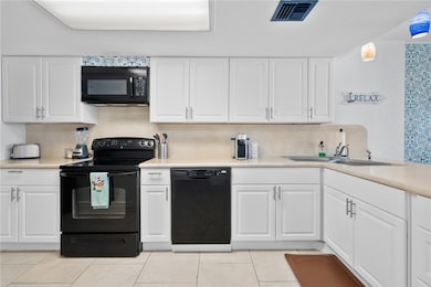 Lovely white cabinets with plenty of cabinets and