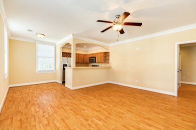 Living room with dining room area on the left.