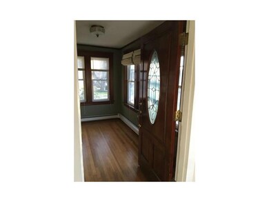 Living Room. front sunroom w/hardwood floors.