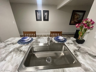 Kitchen featuring a sink and light countertops