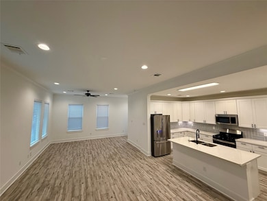 This photo shows a spacious, open-concept living a